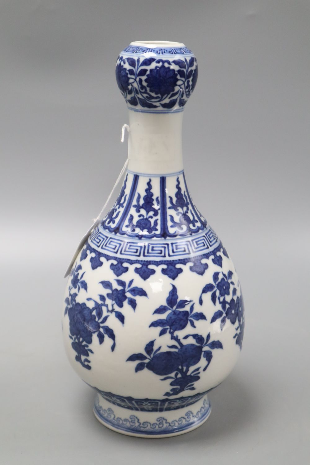A Chinese blue and white garlic neck vase, Qianlong seal mark but later, drilled hole through mark, height 29.5cm
